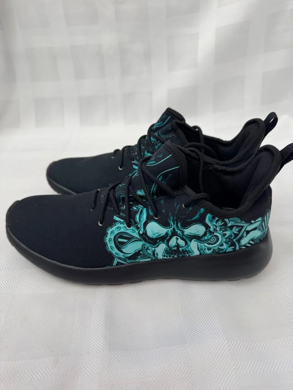 Unisex Black Lightweight Sneakers with Teal Skull Accent